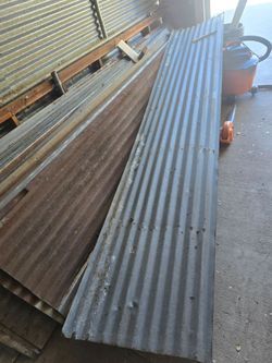 Tin roofing or tin sheets (even though they're usually galvanized steel, not actual tin)
Corrugated roofing tin (very common in classifieds and everyd