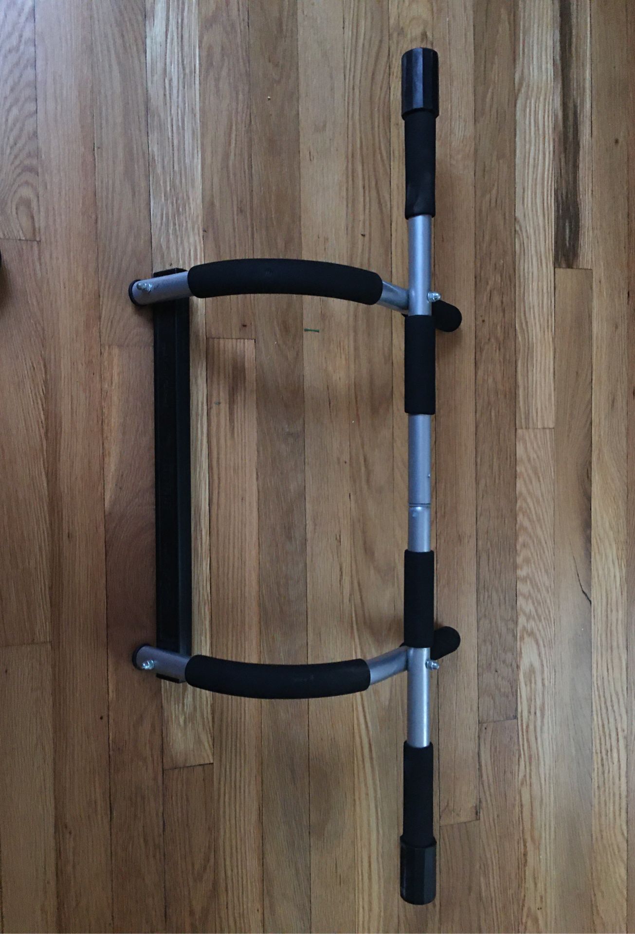 Iron gym door pull-up bar