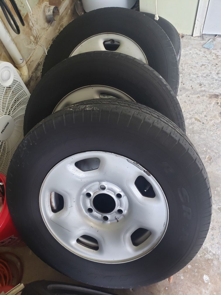 Ford 6 lug wheels and tires with hubcaps