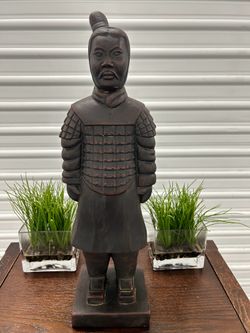 Samurai statue and artificial plants