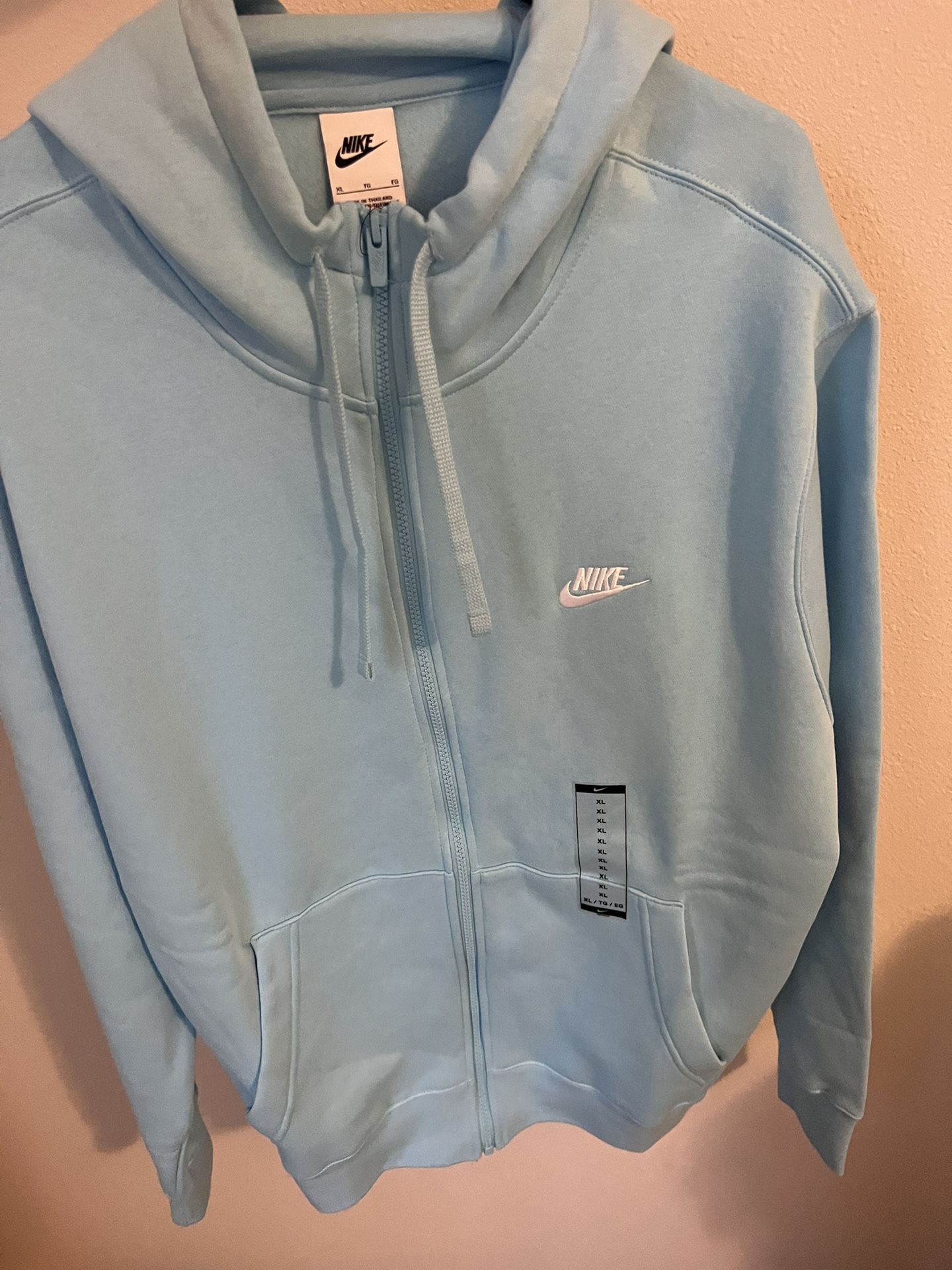 I am selling a Nike zip up jacket, size is XL, the color is light blue