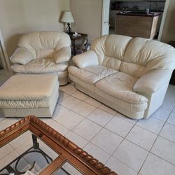 Cream Color Leather Love Seat And Chair And Ottoman. 