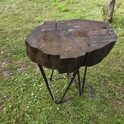 
Rustic wooden table with brown metal legs, suitable for indoor or outdoor use. It measures 29 inches high and 24 inches wide