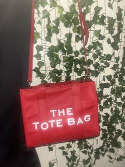 Red “The Tote Bag” crossbody tote bag