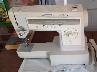 Singer Sewing Machine With Cabinet