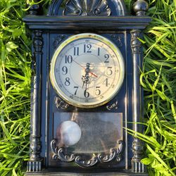 decorative pendulum wall clock designed with a vintage aesthetic