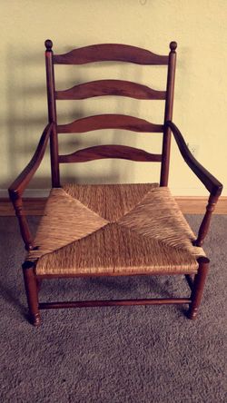 Antique large wood chair with thatch