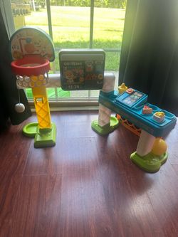 Interactive Fisher-Price Smart Stages 2-in-1 toy has a basketball hoop and an activity center