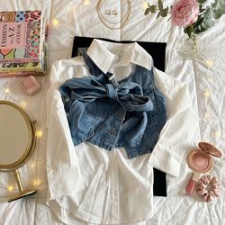 Woman’s white long sleeve with jean shirt vest