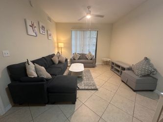 Living room set with tv stand, ottomans and free: 10 pillows, coffee tables, lamp, carpet