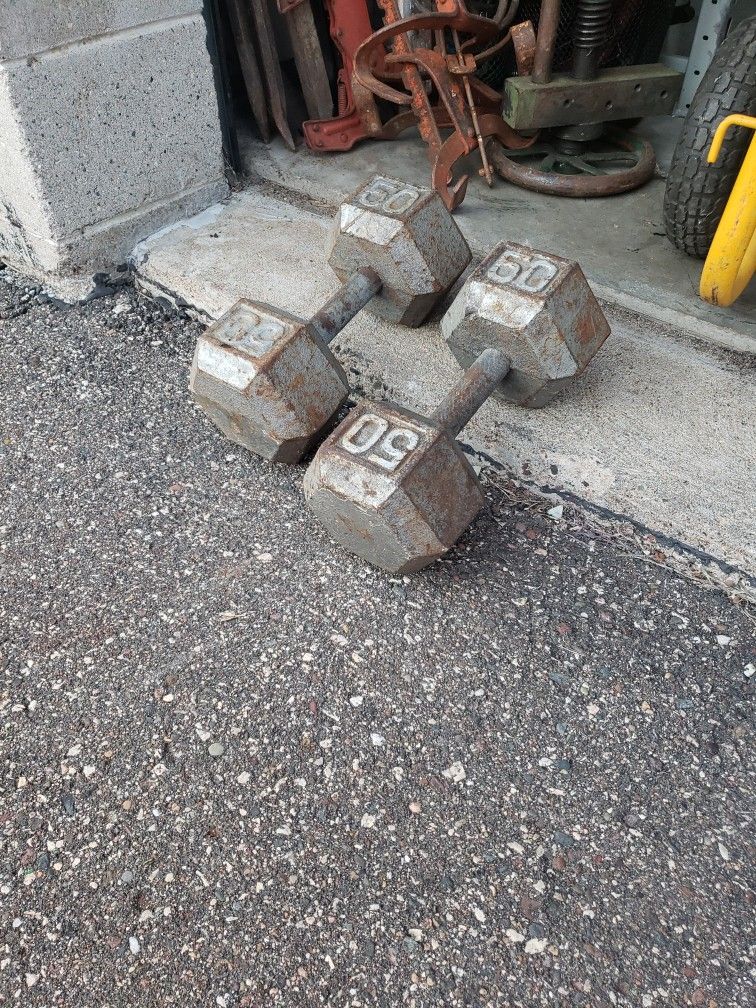 set of 50 pound dumb Bells