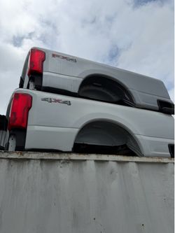 Have 4 brand new for super duty truck beds brand new with bumpers