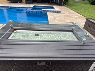 Outdoor fire pit with tank