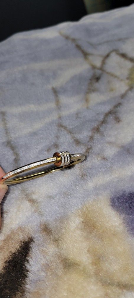 18K gold-filled, stainless steel bangle bracelet with cubic zirconia pavé stones. 
