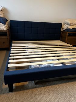 King bed. Upholstered pillowed blue