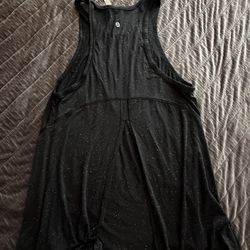 Lululemon black sports top with open back, size 4.