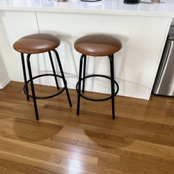 Two Brown And Black Bar Stools 