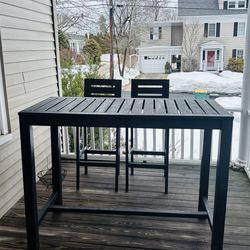 bar-style table and high chairs