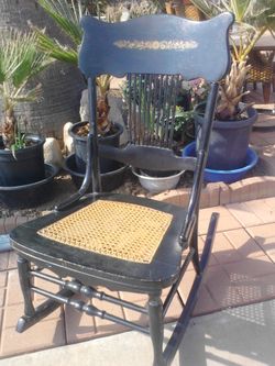 Vintage rocking chair with cane seat