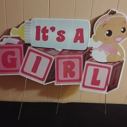 yard sign announcing the birth of a baby girl.