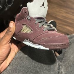 jorden 5 velvet  and jordan 12s black and purple 