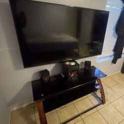 55-inch TCL TV - Tv stand - Speakers