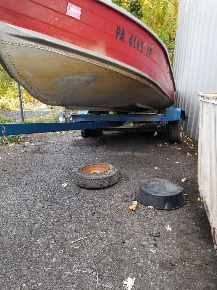 Boat, 14 ft., and trailer.