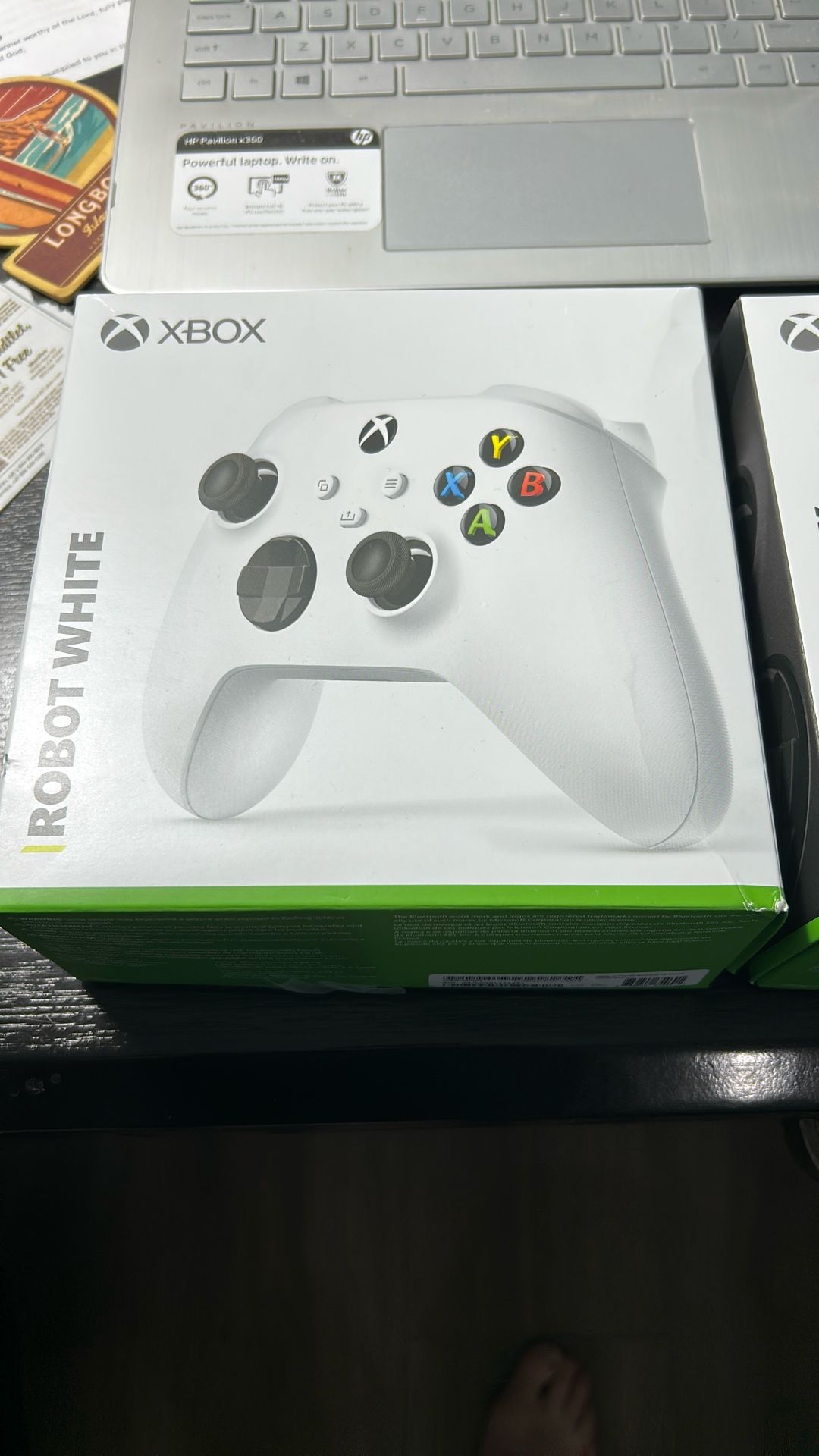 1 White & 1 Black X-Box Controllers - 3 Months Old