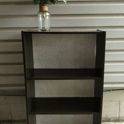 Dark Brown Bookcase With Floral Backing