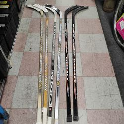 Left and right hockey sticks most are wood