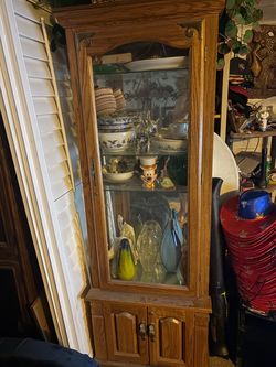 Lighted glass curio cabinet