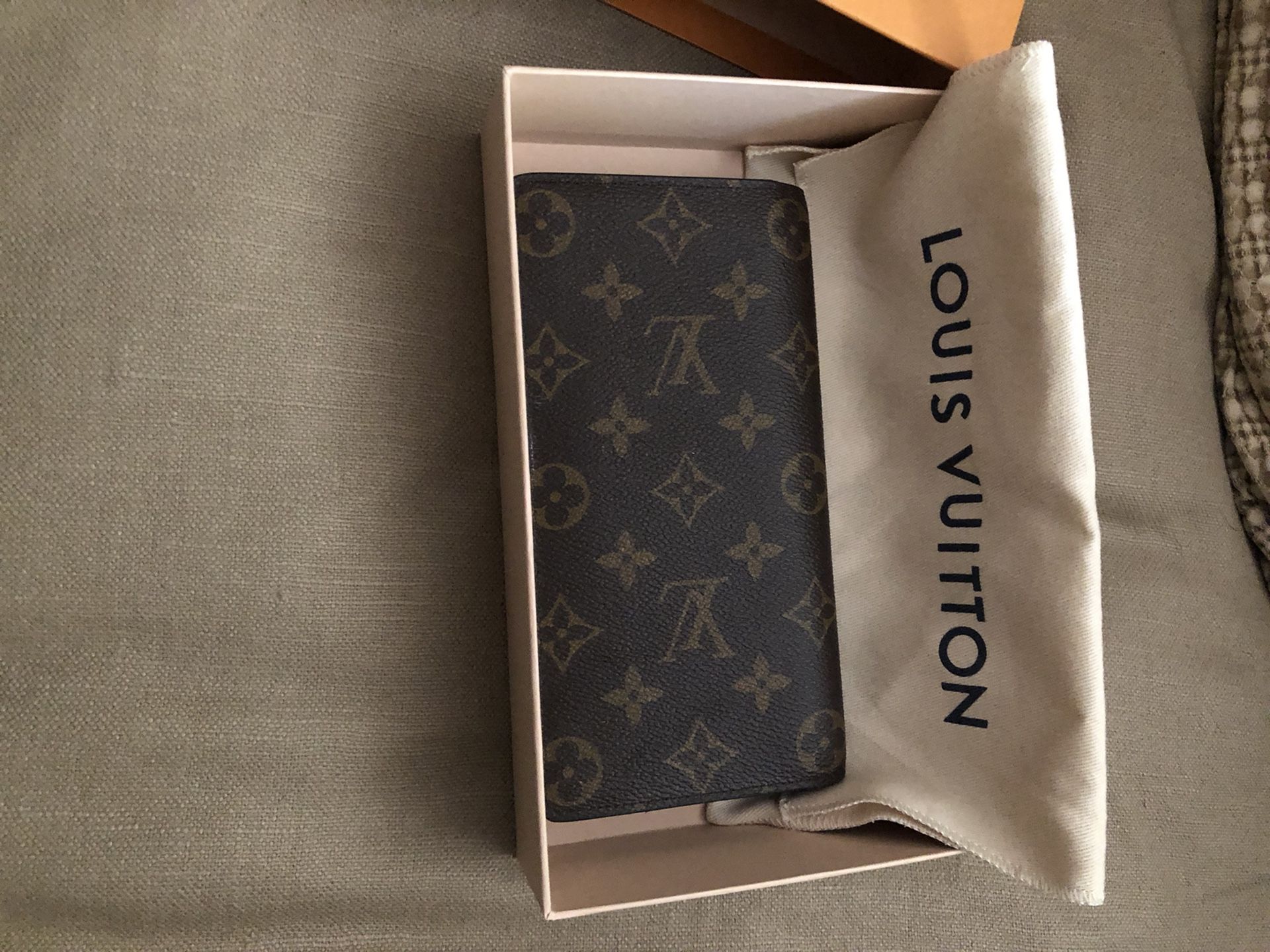 Louis Vuitton wallet, used it 3 days and decided to get a bifold wallet instead. asking 200