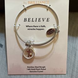 BRACELET WITH CROSS IN IT 