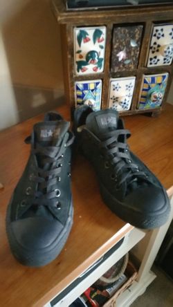 Black low top Chucks. Size 7 men's size 9 women