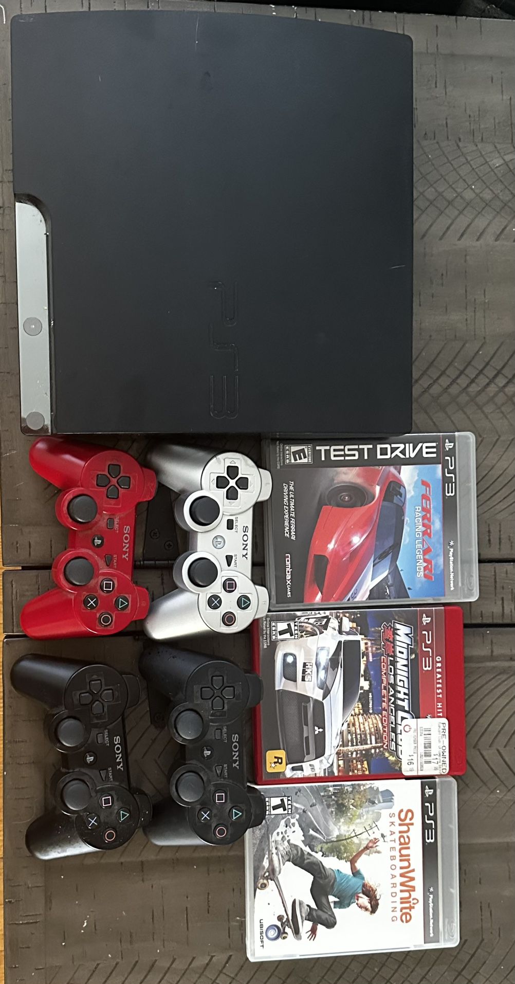 PS3 W/ 4 controllers and 3 Games