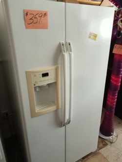 GE side by side refrigerator white works great . Warranty . Delivery available . 2203 Fowler st. Ft. Myers 33901