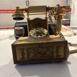 vintage Deco-Tel French Provincial style rotary phone.