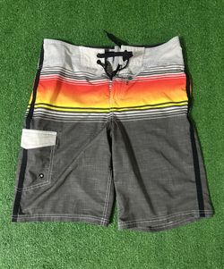 Men’s Mossimo Grey and orange striped swim trunks with adjustable drawstring waistband and mesh lining size 32