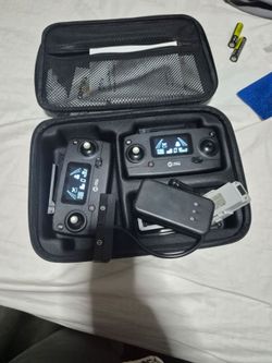 Holy stone 1 battery, 2 remote controls 1 charger and one case