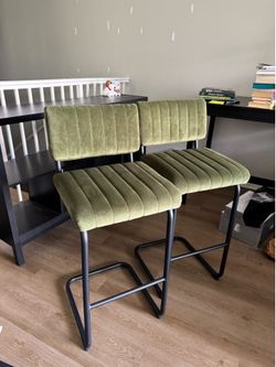 Set of two green countertop barstools