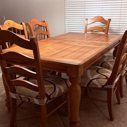 Wooden dining table with 6 chairs