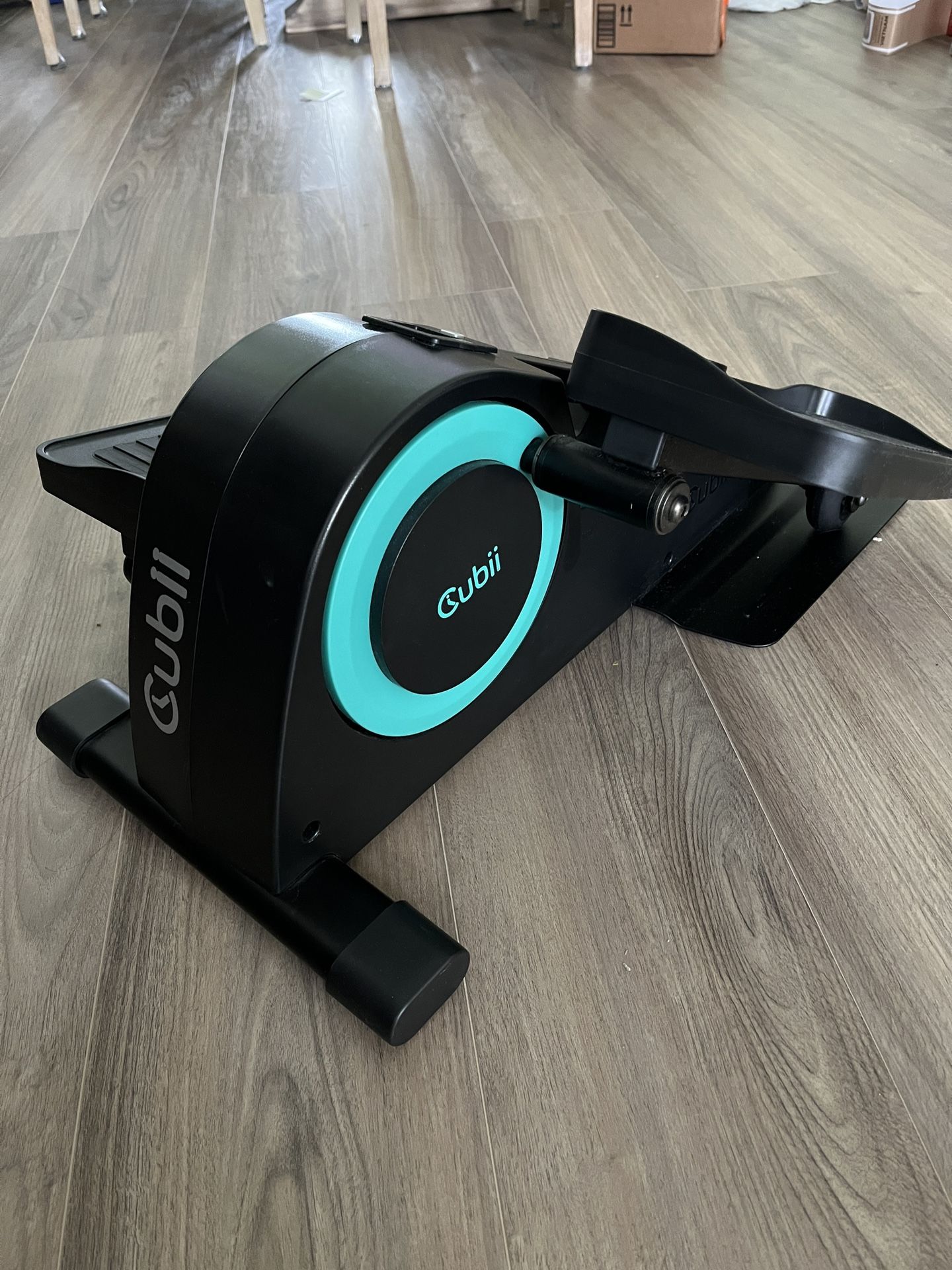 Cubii under desk, elliptical machine