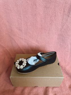Children’s black flats with pearl details