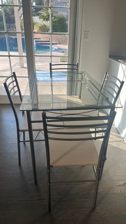 Glass 4-seater dining table