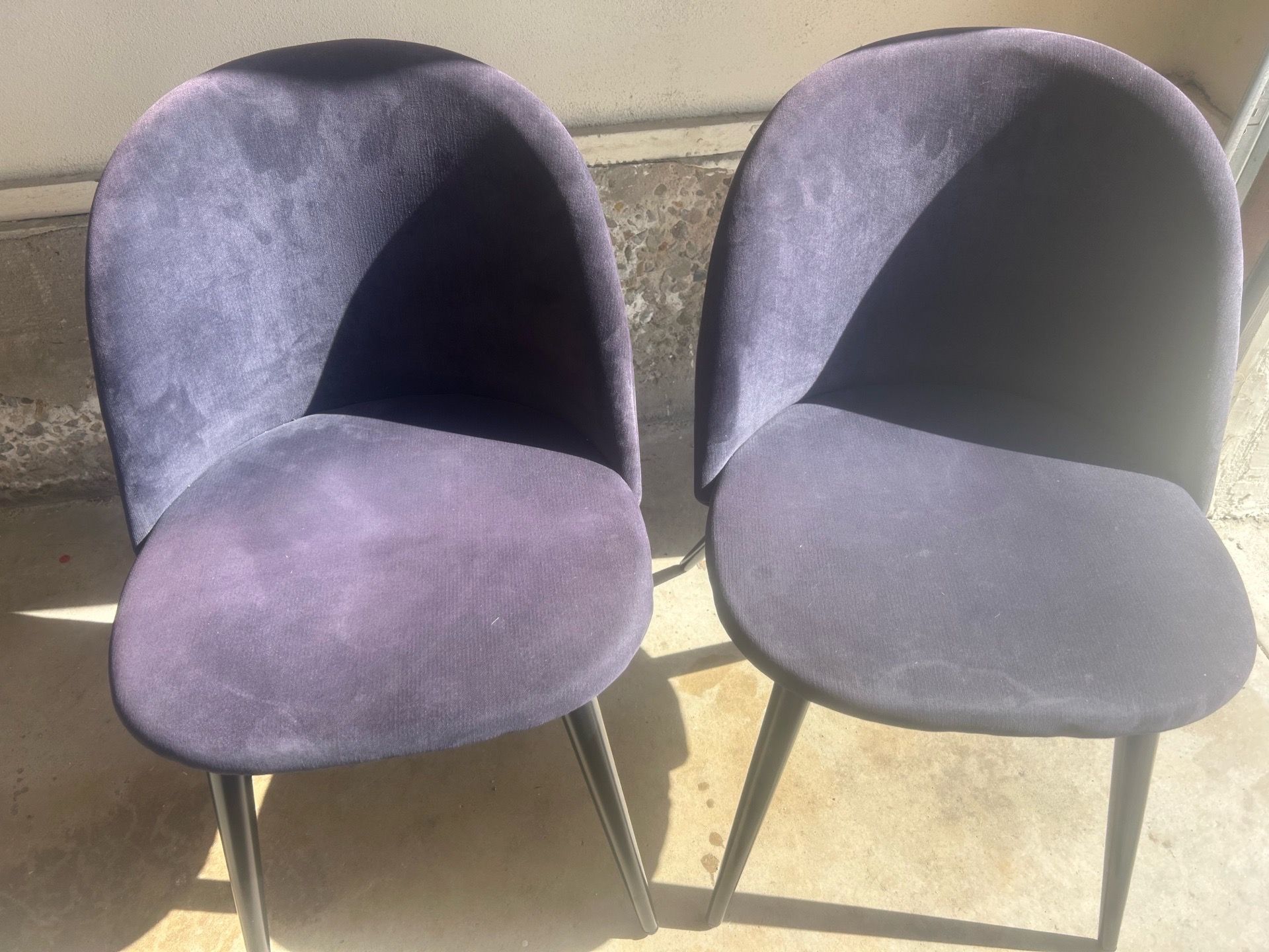 Two blue velour chairs