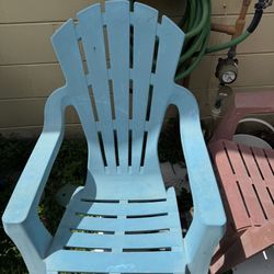Set of two blue and coral resin patio Adirondack chairs