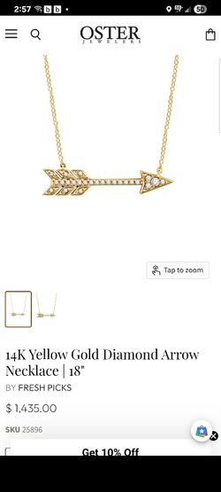 sparkling diamond arrow necklace. Set with .10ctw of brilliant diamonds in 14K yellow gold