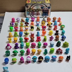 Lot of 81 Gogo's Crazy Bones with collector tin
