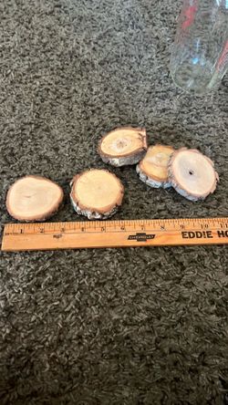Small, round natural wood slices (or wood rounds/disks