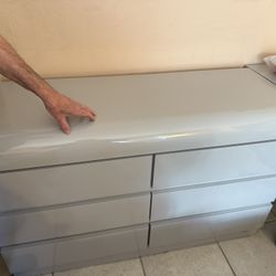 Grey dresser and nightstand and desk with drawers 